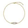 Bracelet ELYSIA en or jaune 18 carats avec diamant taille émeraude central et deux diamants ronds