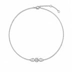 Bracelet ALBA en or blanc 18 carats serti d’un diamant rond central et de deux diamants poire.